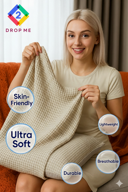 Smiling woman holding a beige waffle weave blanket labeled ultra soft, breathable, lightweight, and durable.