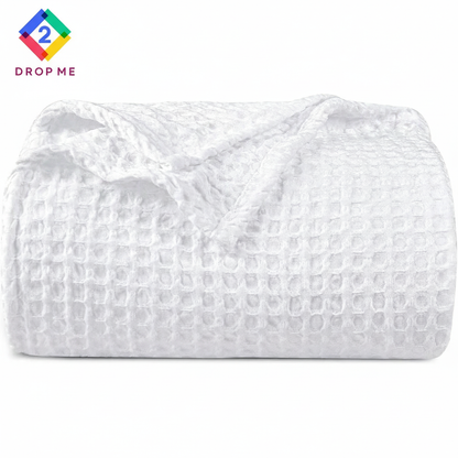 Lightweight pre-washed waffle weave blanket in ivory, durable and elegant bedding accessory.