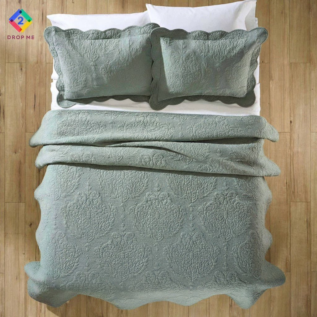 Sage green paisley cotton quilt with scalloped edges on queen bed – cozy and decorative bedding from Better Homes & Gardens 🌿