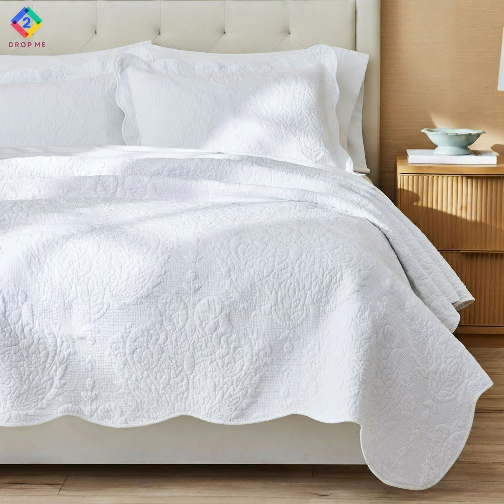 White embroidered cotton quilt with medallion pattern on tufted bed – modern cozy bedroom look 🤍